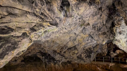 A breathtaking view of a limestone cave interior with stalactites, perfect for illustrating geology concepts or adventure travel