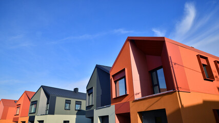 Terraced family homes in newly developed housing estate. The real estate market in the suburbs. New...