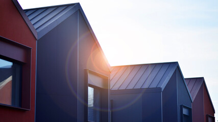 Terraced family homes in newly developed housing estate. The real estate market in the suburbs. New...
