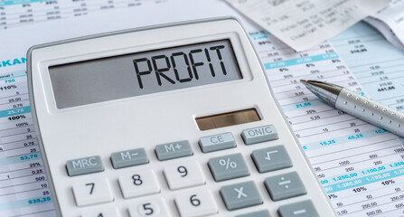 A calculator with the word Profit on the display