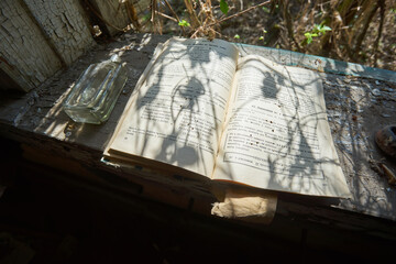 Open Book on Dusty Window Sill