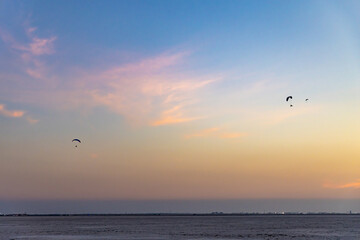para motors flying in pristine sunset dramatic blue sky at dusk
