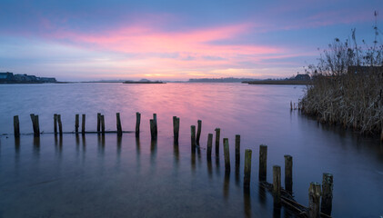 Dawn at the waterfront on a windy morning in Meerstad, the Netherlands