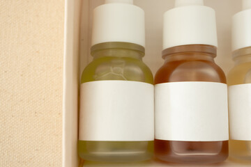 Close-up facial serum beauty skincare products in bottles with blank labels