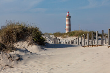 Aveiro lighthouse and dunes on Barra beach. Aveiro, Portugal