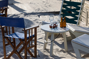 Beach terrace, sand, beach, cafe, summer, decoration, chairs, wood, white wood, director's chair, white table, relax, rest, leisure, vacation
