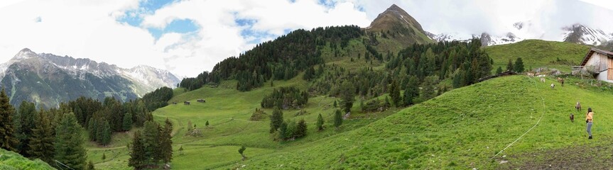 Scenic Alpine Landscape in Zillertal, Tirol, Austria &ndash; Green Meadows, Wooden Huts, and Grazing Goats
