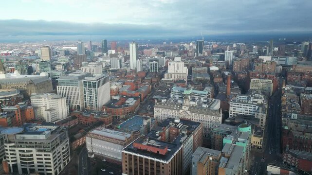 Aerial drone shot across Manchester shot from the west looking east at Deansgate Square, Manchester, UK