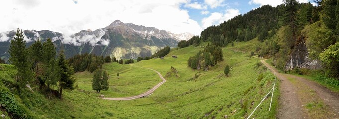 Idyllic Alpine Landscape in Zillertal, Tirol, Austria &ndash; Winding Mountain Path Through Green Meadows