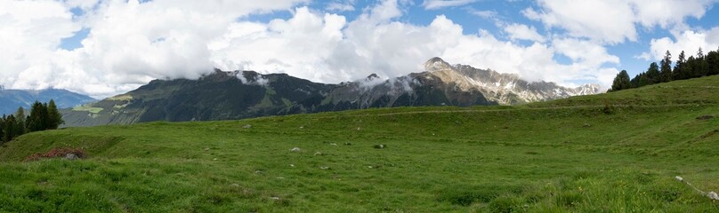 Panoramic Alpine Landscape with Green Meadows and Mountain Peaks in Zillertal, Tirol, Austria