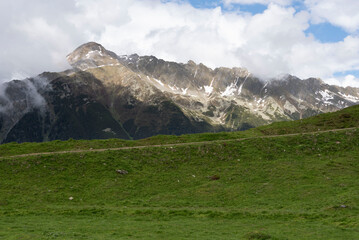Dramatic Alpine Mountain Range with Green Meadows in Zillertal, Tirol, Austria