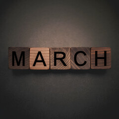 Naklejka premium March Wood Block Words on Gradient Background