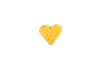 Creative composition for Valentine's Day with slice of cheese cut in heart shape and isolated on white background. Top view.