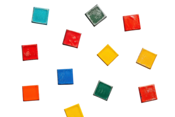 Colorful arrangement of vibrant geometric tiles scattered on a white surface, showcasing playful hues and artistic potential for creativity isolated on transparent background