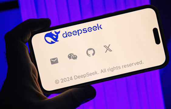Paris, France - Jan 28, 2025: Smartphone screen displaying the DeepSeek logo with contact icons for email, social media, and GitHub as footer notes 2024 DeepSeek with blue-lit background enhances visu