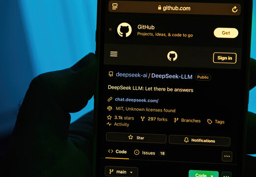 Paris, France - Jan 28, 2025: GitHub page for DeepSeek LLM highlights Let there be answers with 3.1k stars, 297 forks, MIT license, linking to chat.deepseek.com for further insights