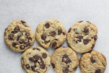 Overhead view of chocolate chip cookies, top view of homemade chocolate chip cookies on a white background