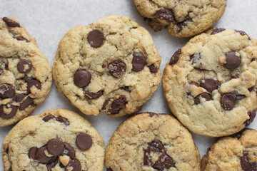 Overhead view of chocolate chip cookies, top view of homemade chocolate chip cookies on a white background