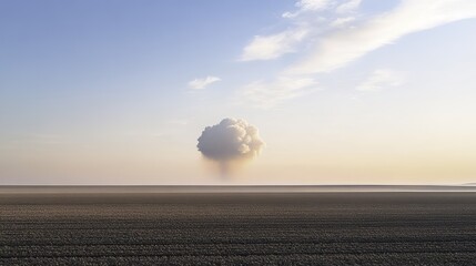 Obraz premium A tranquil landscape disrupted by a distant explosion, blending calm and chaos under soft sunlight.