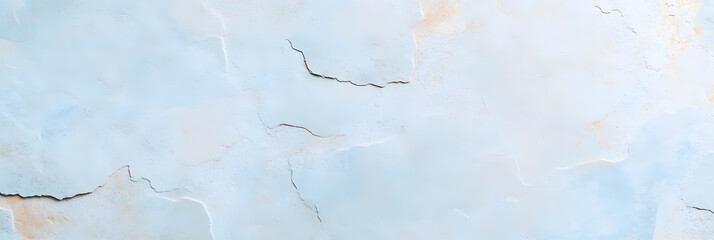 Fototapeta premium A wide banner showcasing a stone wall surface with a delicate mix of dusty silver grey, pale blue, and off-white tones. The texture highlights natural imperfections and faint grooves, exuding a