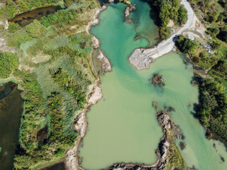 Gravel pit. Turbid water at the place where the gravel is extracted. Polluted water caused by...