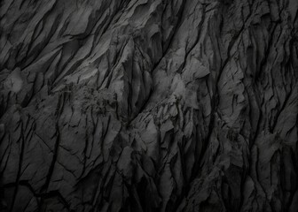 Fototapeta premium High-Contrast Black and White Close-Up of Rugged Rocky Terrain with Intricate Textures and Dramatic Light Play.