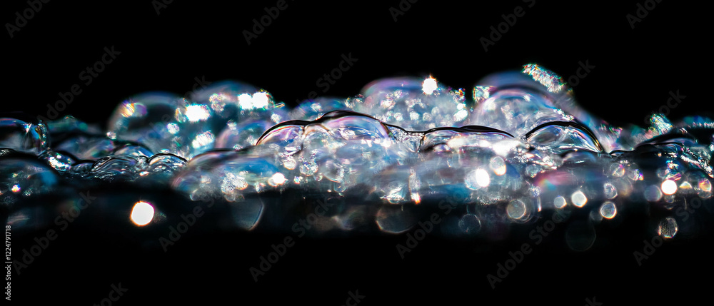 Poster clear bubbles in focus float gracefully, revealing intricate details and reflections