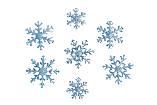 Delicate blue snowflakes scattered on a smooth white surface, capturing the essence of winter’s chill and beauty in a serene arrangement isolated on transparent background