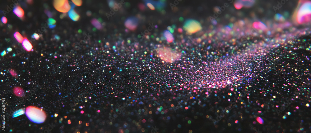 Aufkleber sparkling glitter texture creating a festive atmosphere with shiny particles on a dark background