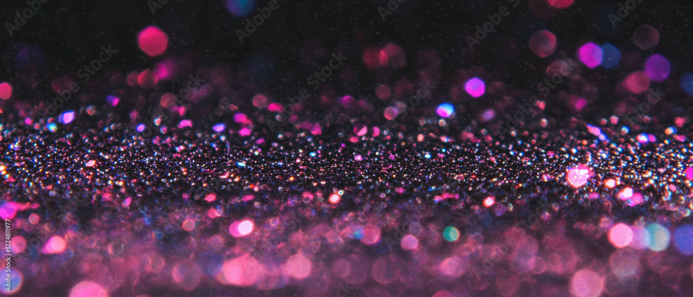 Poster glittering particles create a festive atmosphere against a dark background