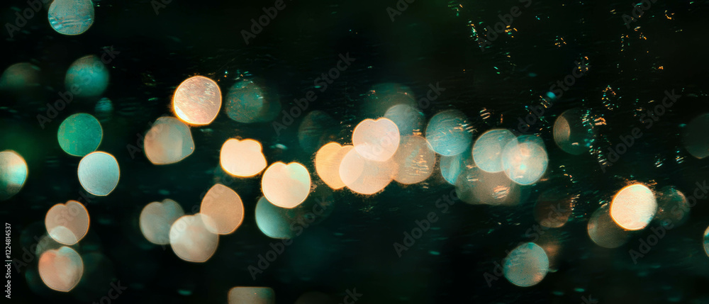 Poster Romantic bokeh texture with heart shapes illuminating a dark background