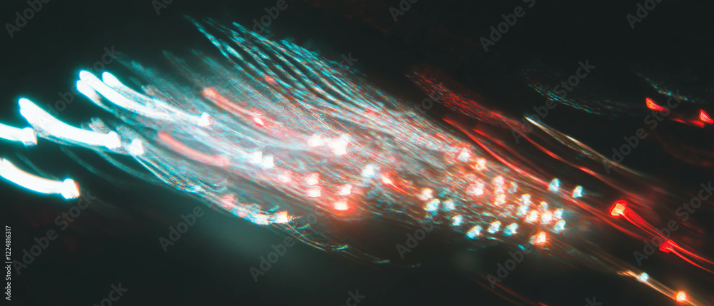 Poster streaks of vibrant light trails create a dynamic and modern texture against a dark background