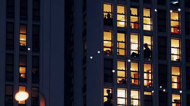 Multiple views of an apartment building at night, showing silhouettes of people in their illuminated windows, creating a sense of urban life and community
