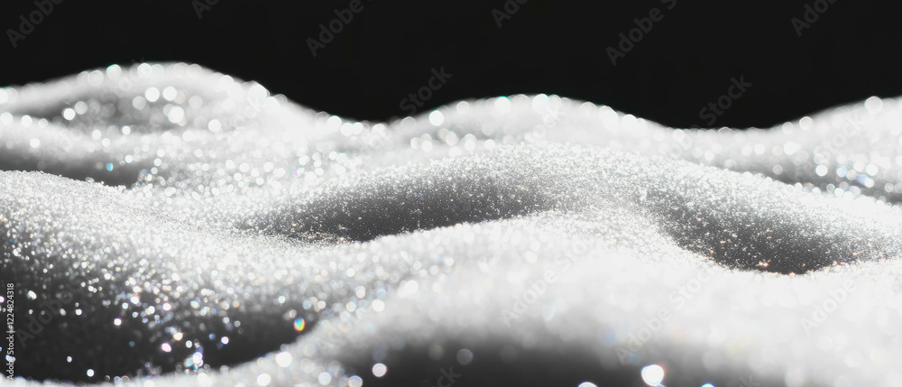 Poster Melting snow texture with glistening effect on a black background creates a captivating view