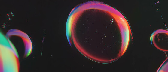 Large bubble reflecting light and displaying vibrant rainbow colors against a dark background