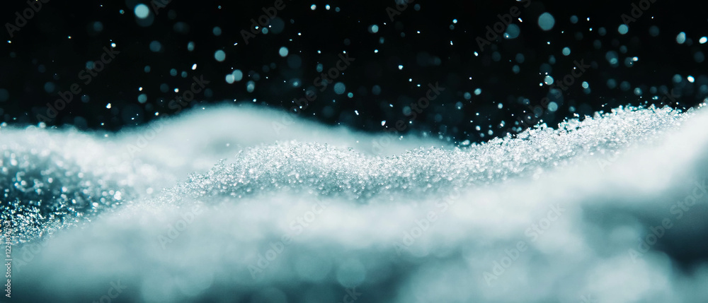 Poster snow texture with a subtle blue tint against a dark background evoking a winter atmosphere