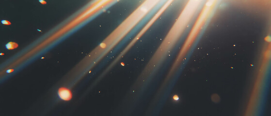 Obraz premium Subtle light rays highlighting a hazy atmosphere against a dark background for creative projects