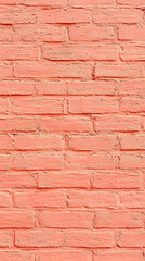 Obraz premium Close-up of a vibrant coral-colored brick wall creates a textured and visually appealing backdrop.
