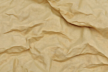 Beige Fabric Texture Background Displays Soft and Elegant Draped Cloth