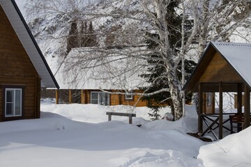 A wooden house in a remote mountain village in winter
