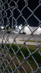 Fototapeta premium Industrial park security simple metal chain-link fence