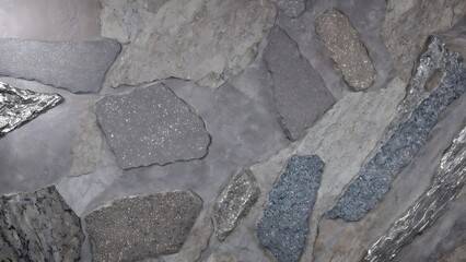 stone texture with metallic flecks embedded in its surface.