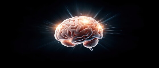 Fototapeta premium A glowing brain with radiant light effects against a dark background, symbolizing intelligence, creativity, and cognitive power.