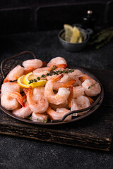 Frozen uncooked prawns or shrimps with lemon