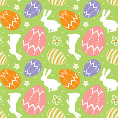 Easter bunny and eggs, spring.  Seamless pattern on green background. Vector.