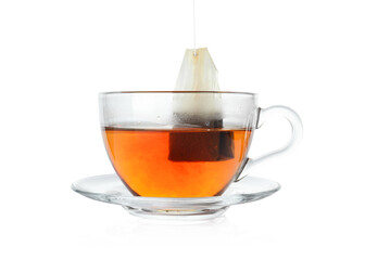 Cup with teabag isolated on white. Brewing aromatic tea