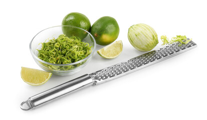 Lime zest, grater and fresh fruits isolated on white