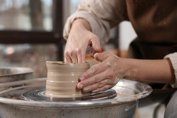Hobby and craft. Woman making pottery indoors, closeup