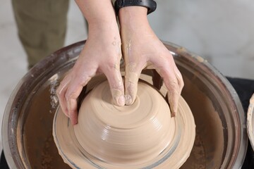 Hobby and craft. Woman making pottery indoors, closeup