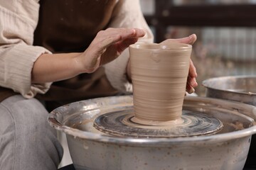 Hobby and craft. Woman making pottery indoors, closeup